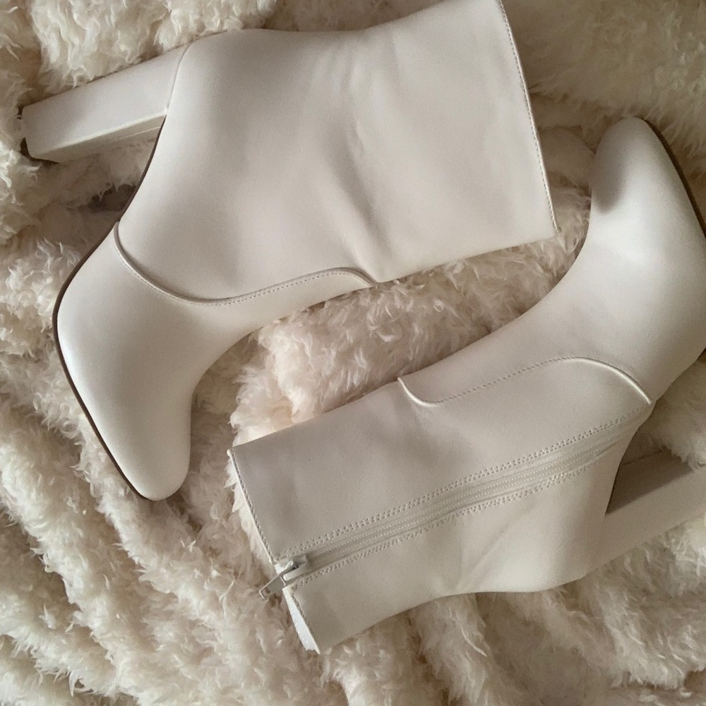 White zip up boots over ankle